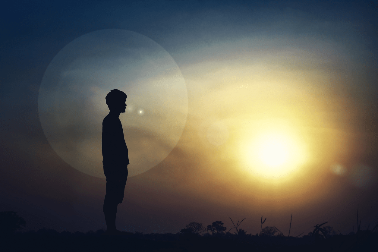 man watching sunset under the moon