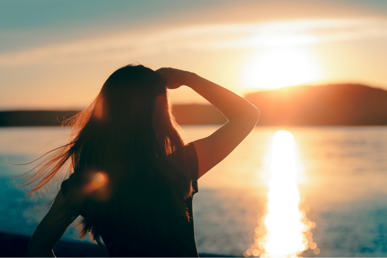 woman watching sunset